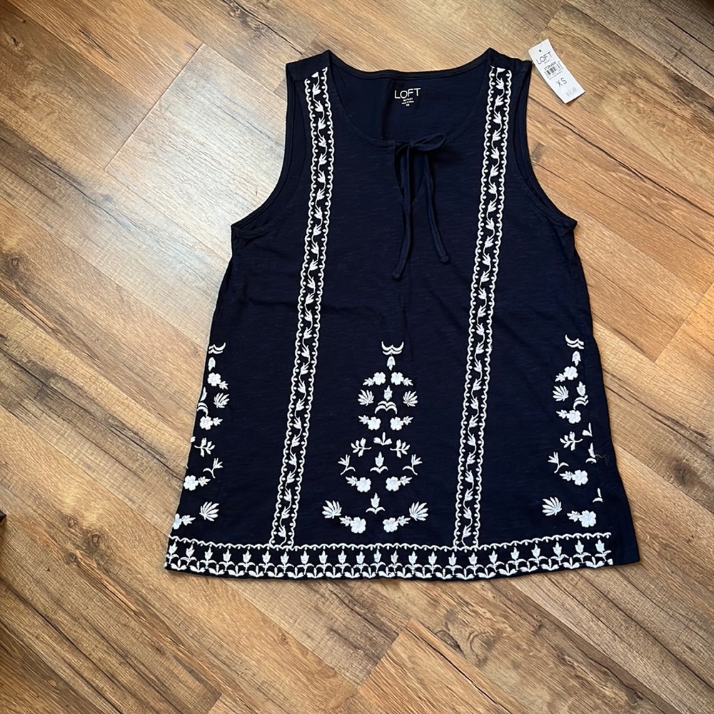 Navy blue and white embroidered top